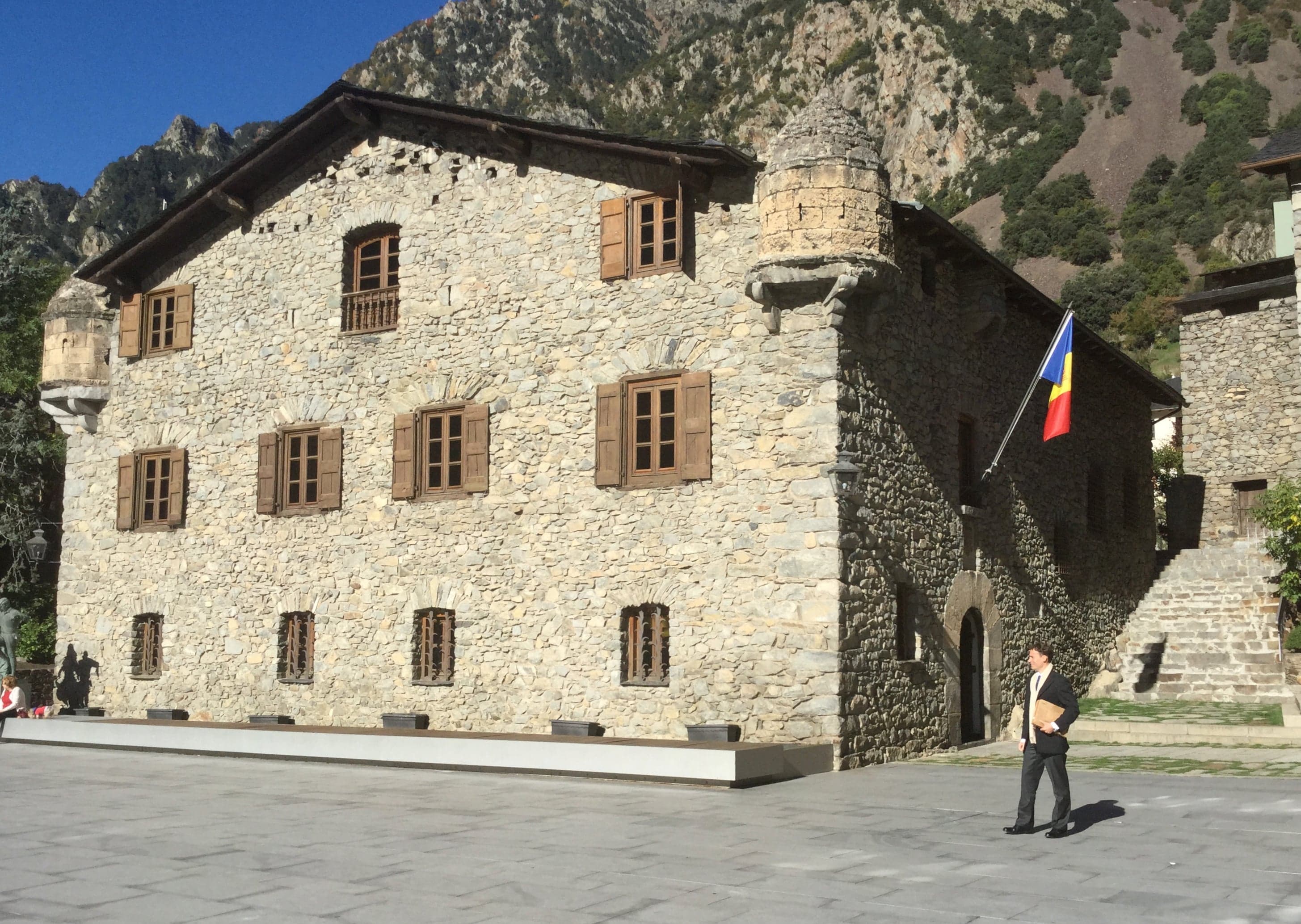 The stone facade of Casa de la Vall in Andorra la Vella on a sunny day