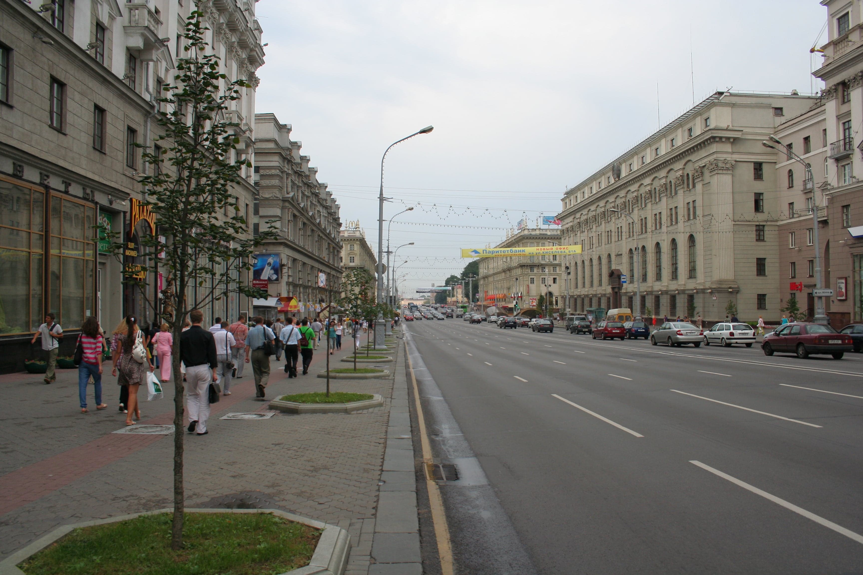 Wide tree-lined Independence Avenue in Minsk with grand buildings on either side