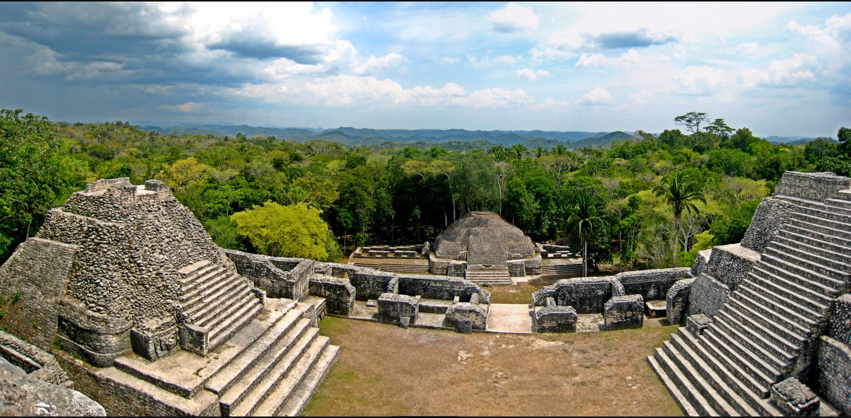 The tall stone pyramid of Caana rising above the jungle canopy at Caracol