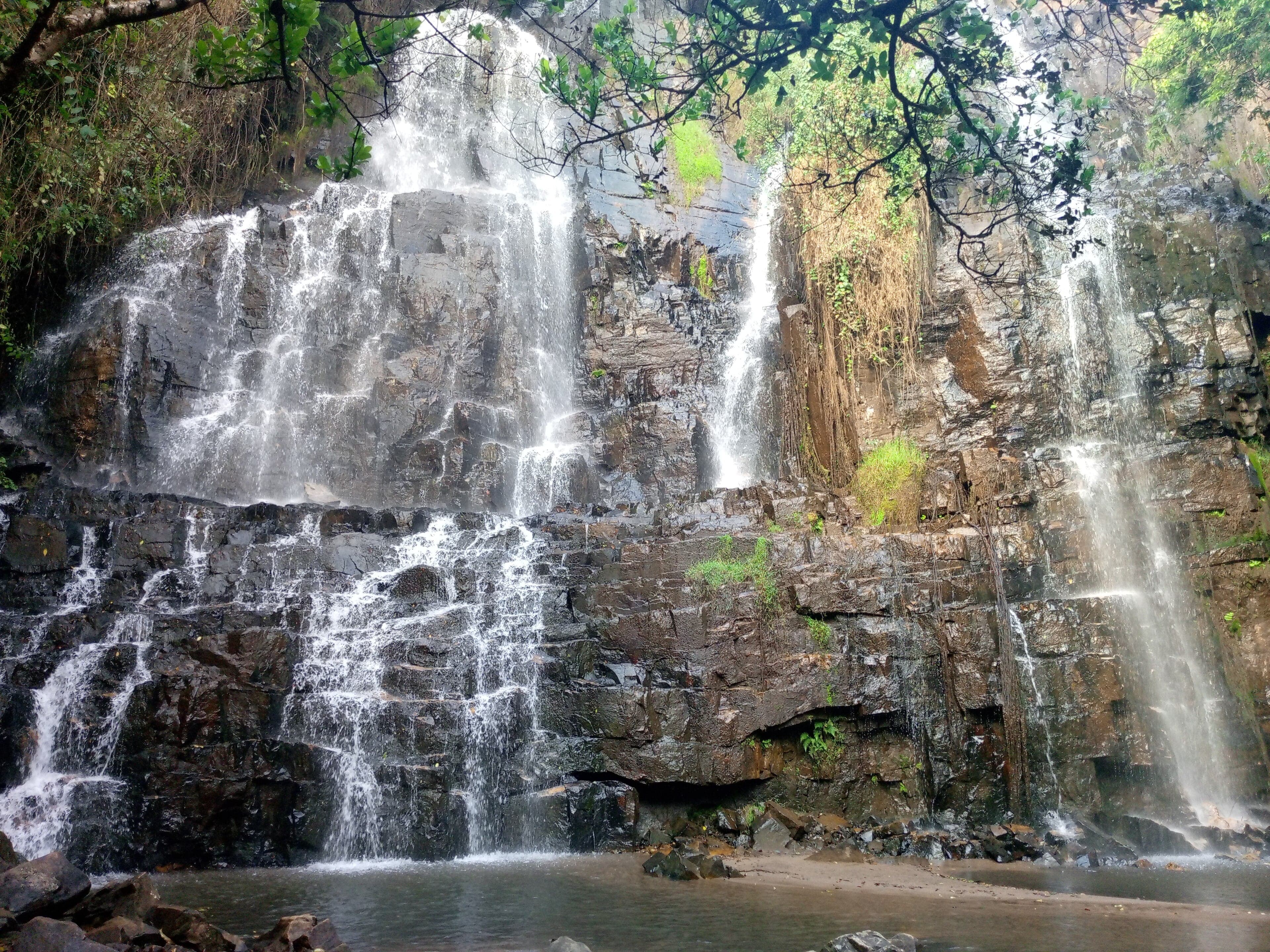 Karera waterfalls cascading through lush green jungle in Burundi