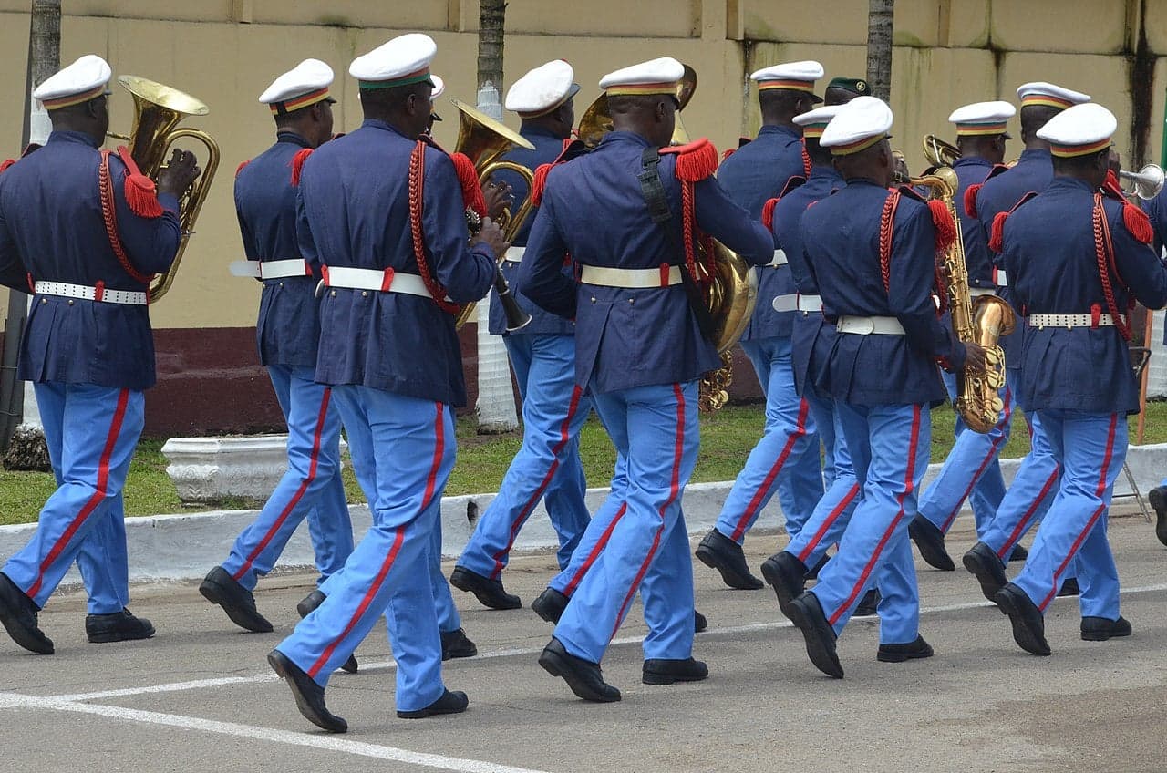 Cameroonian schoolchildren in national colours marching in a National Day parade