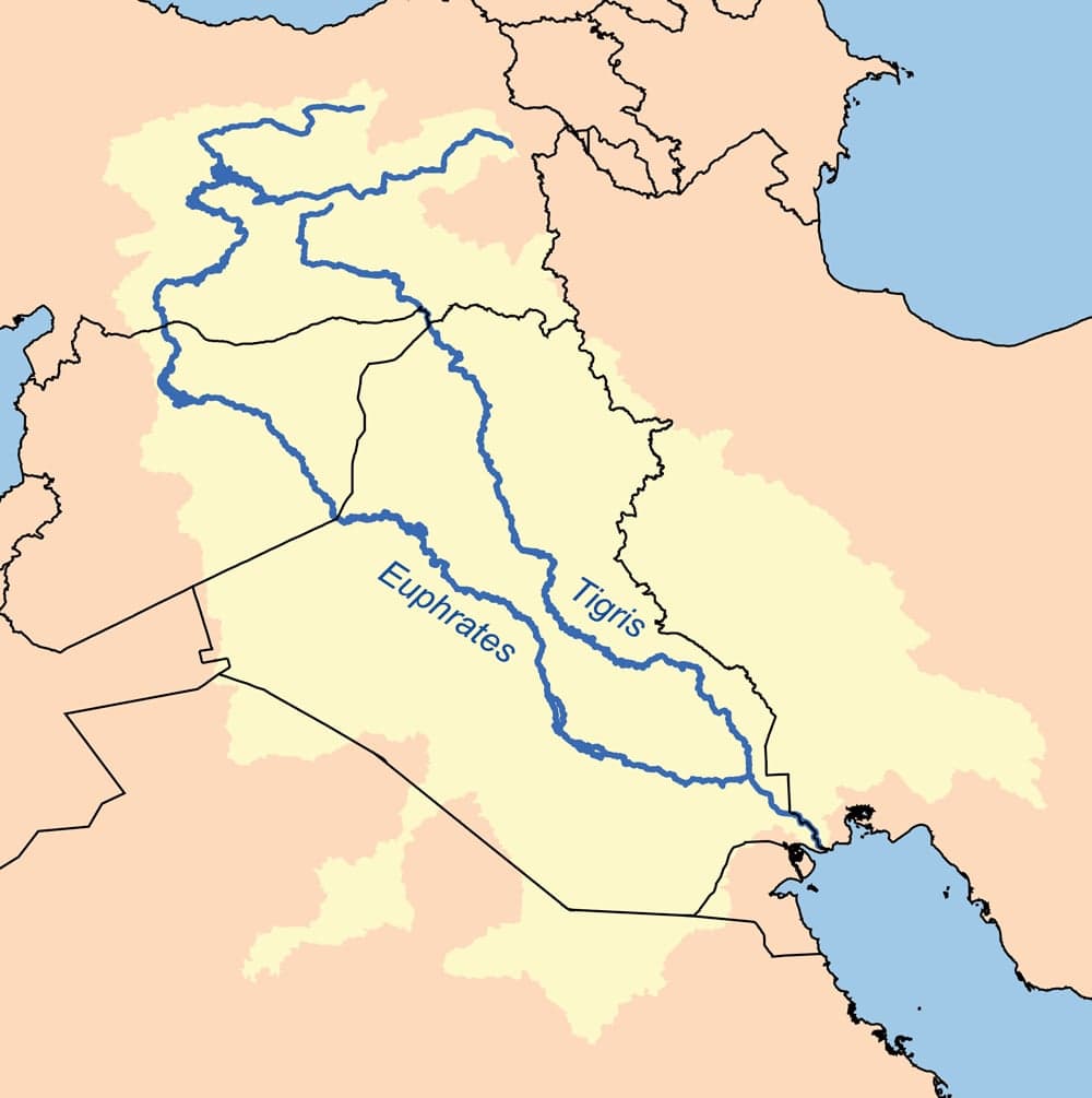 The wide blue Tigris River winding through Baghdad, with palm trees along its banks