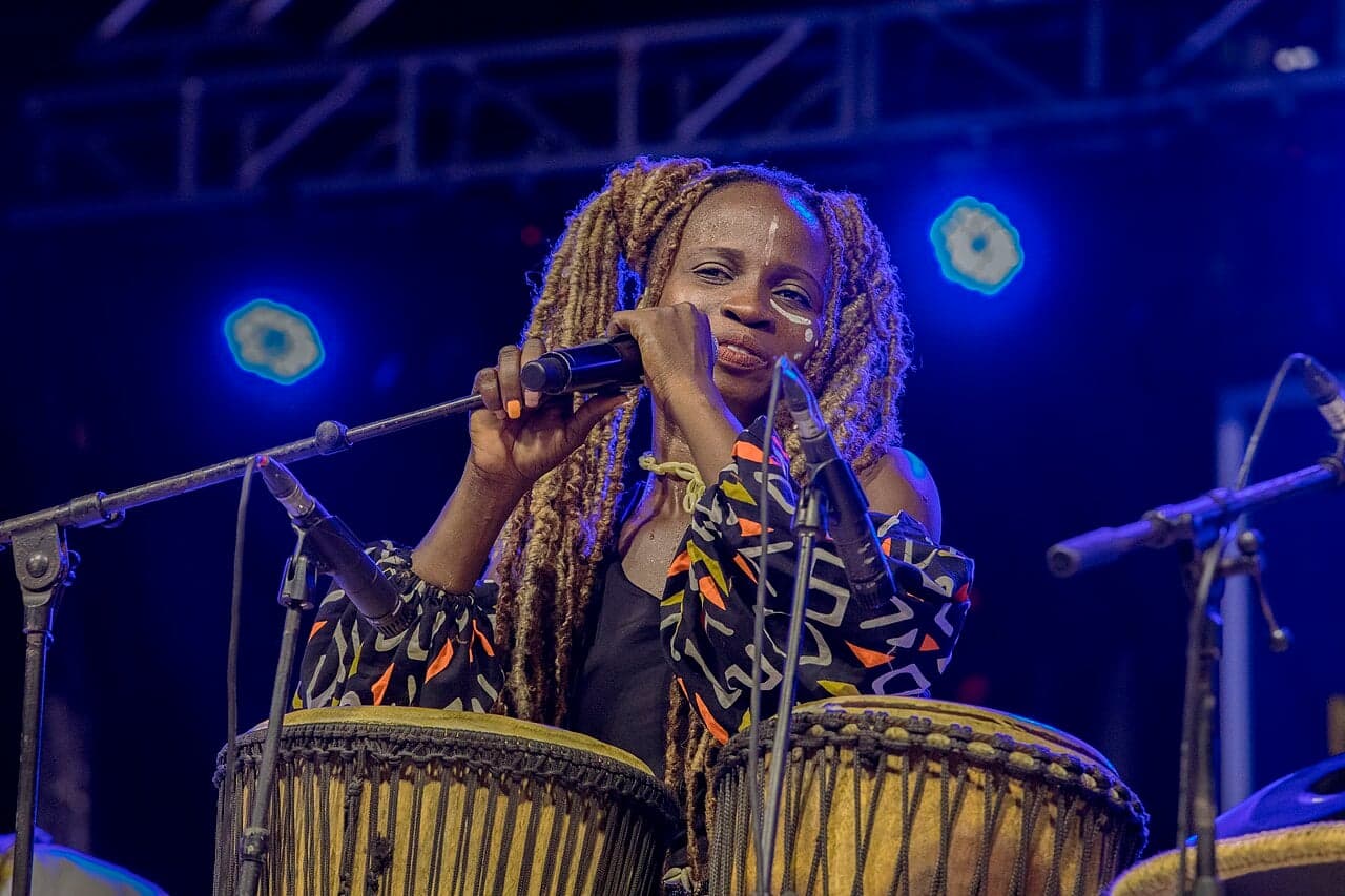 Musicians performing zouglou music on a colourful stage in Abidjan