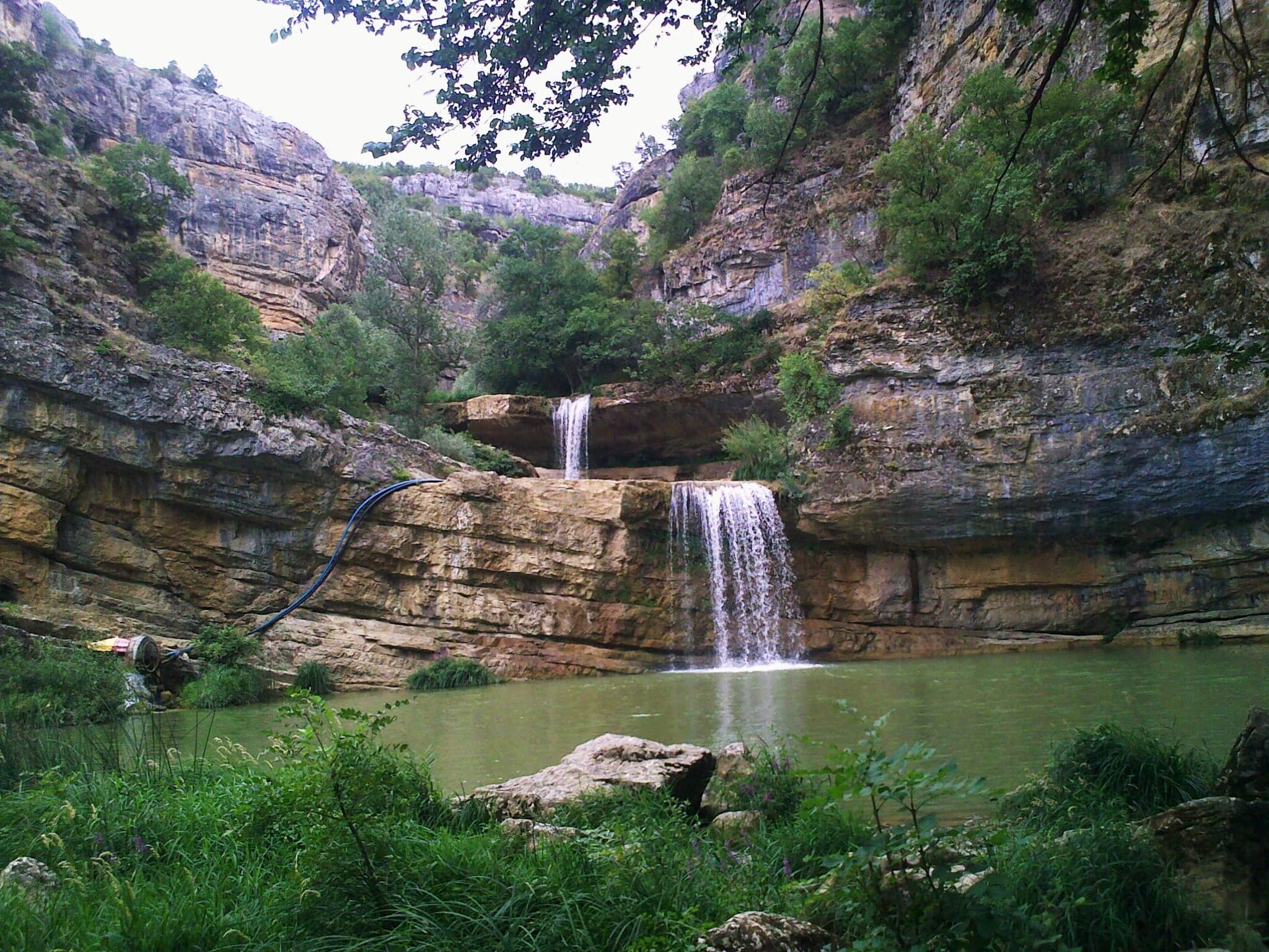 Clear turquoise pools linked by small waterfalls in the Mirusha gorge