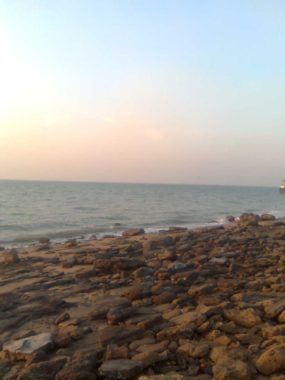 Sandy shoreline and blue water at Failaka Island, Kuwait