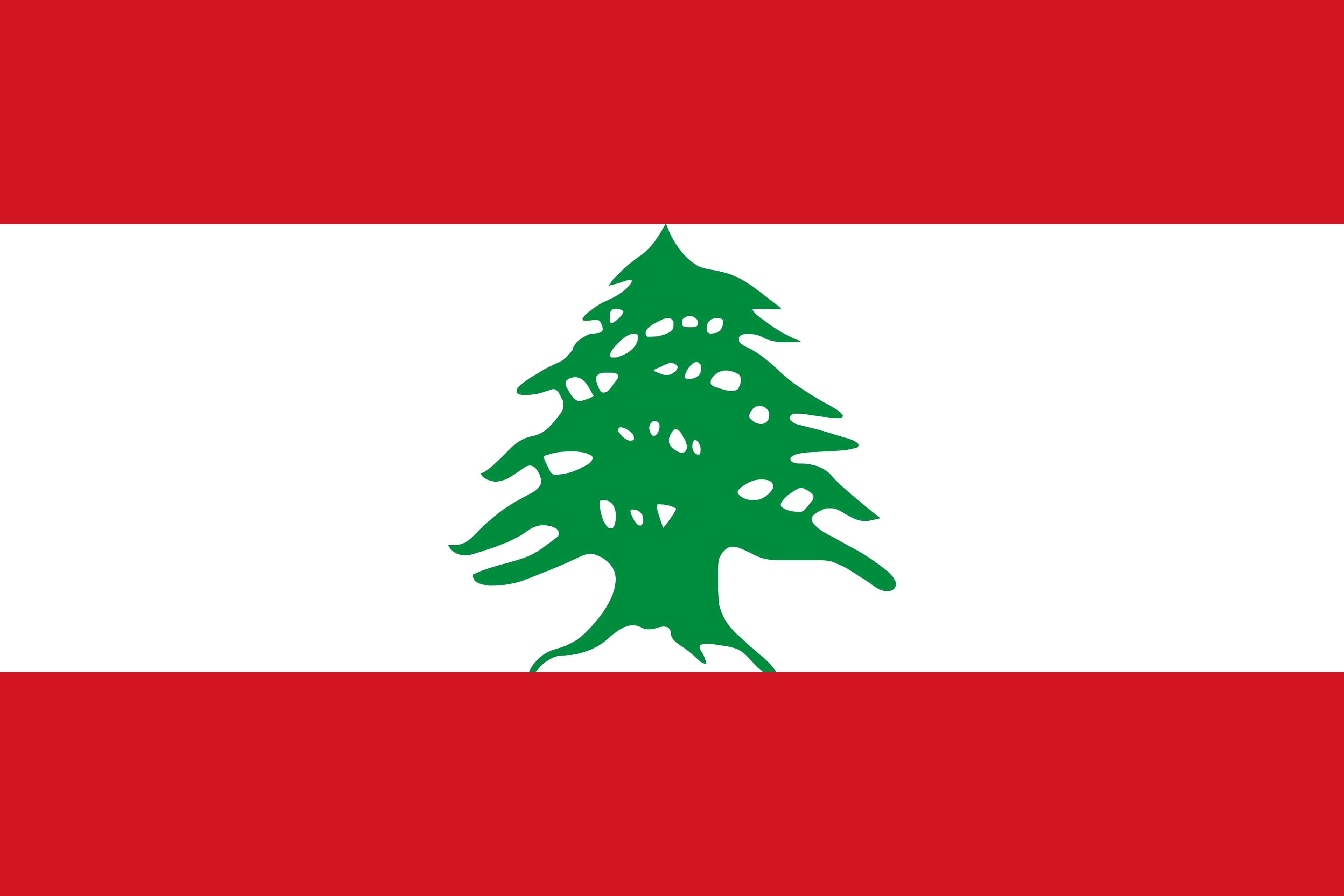 Lebanese flags flying along a Beirut street with red, white and green decorations