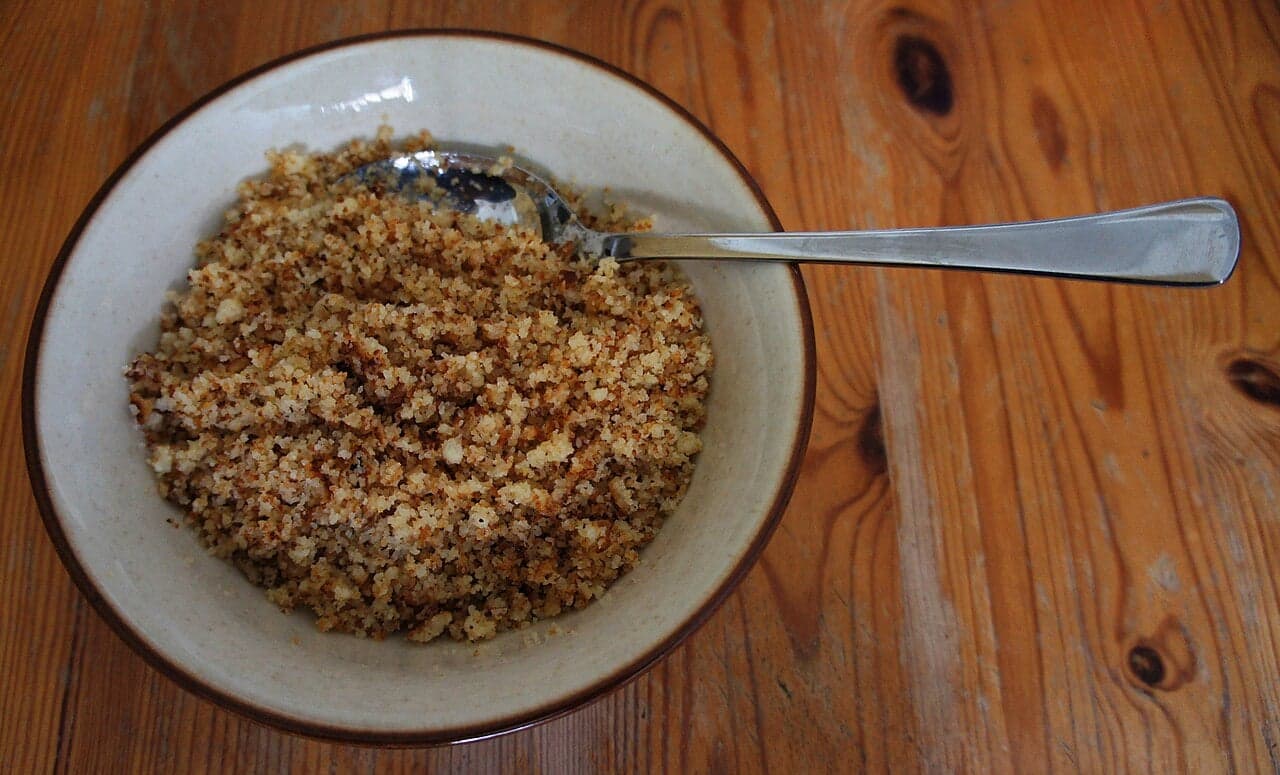 A golden pan of Ribel - toasted cornmeal crumbles with a crisp surface