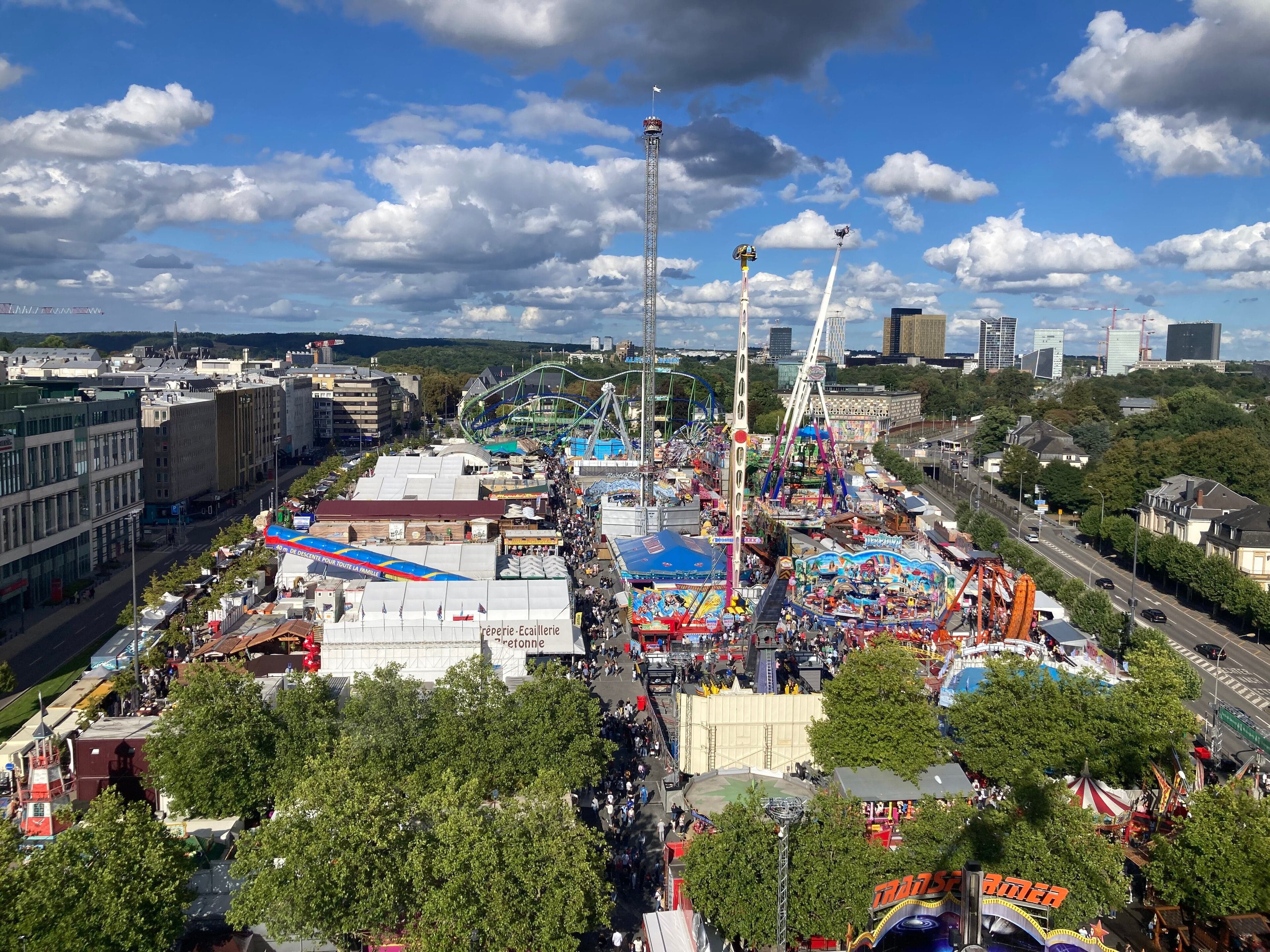 The Schueberfouer funfair at night with illuminated rides and stalls