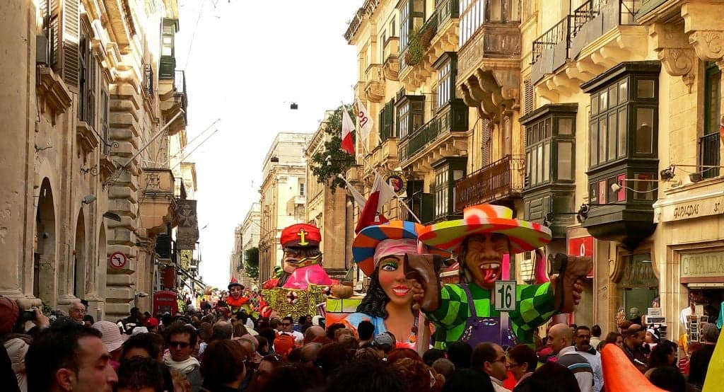 A colourful carnival float in a Maltese town square