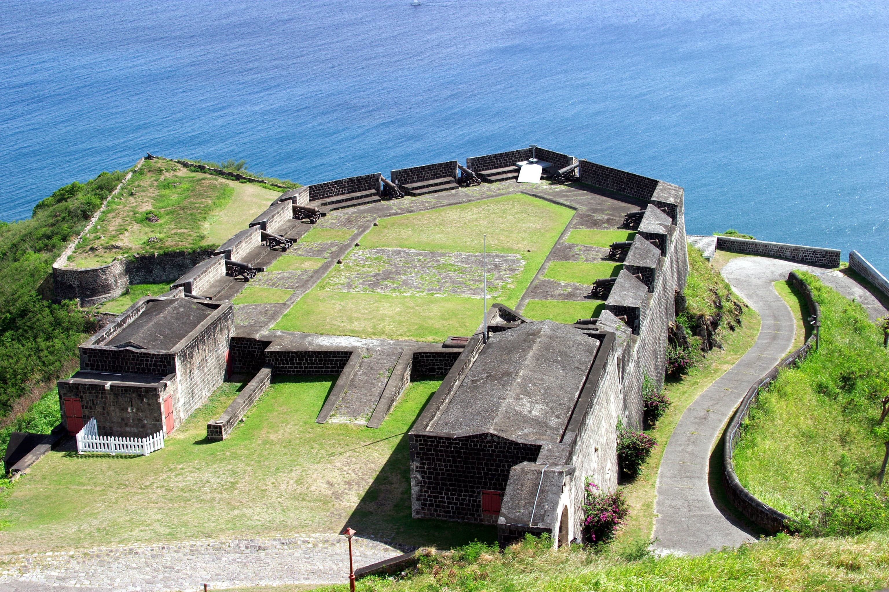 The grey stone walls of Brimstone Hill Fortress perched on a volcanic hilltop