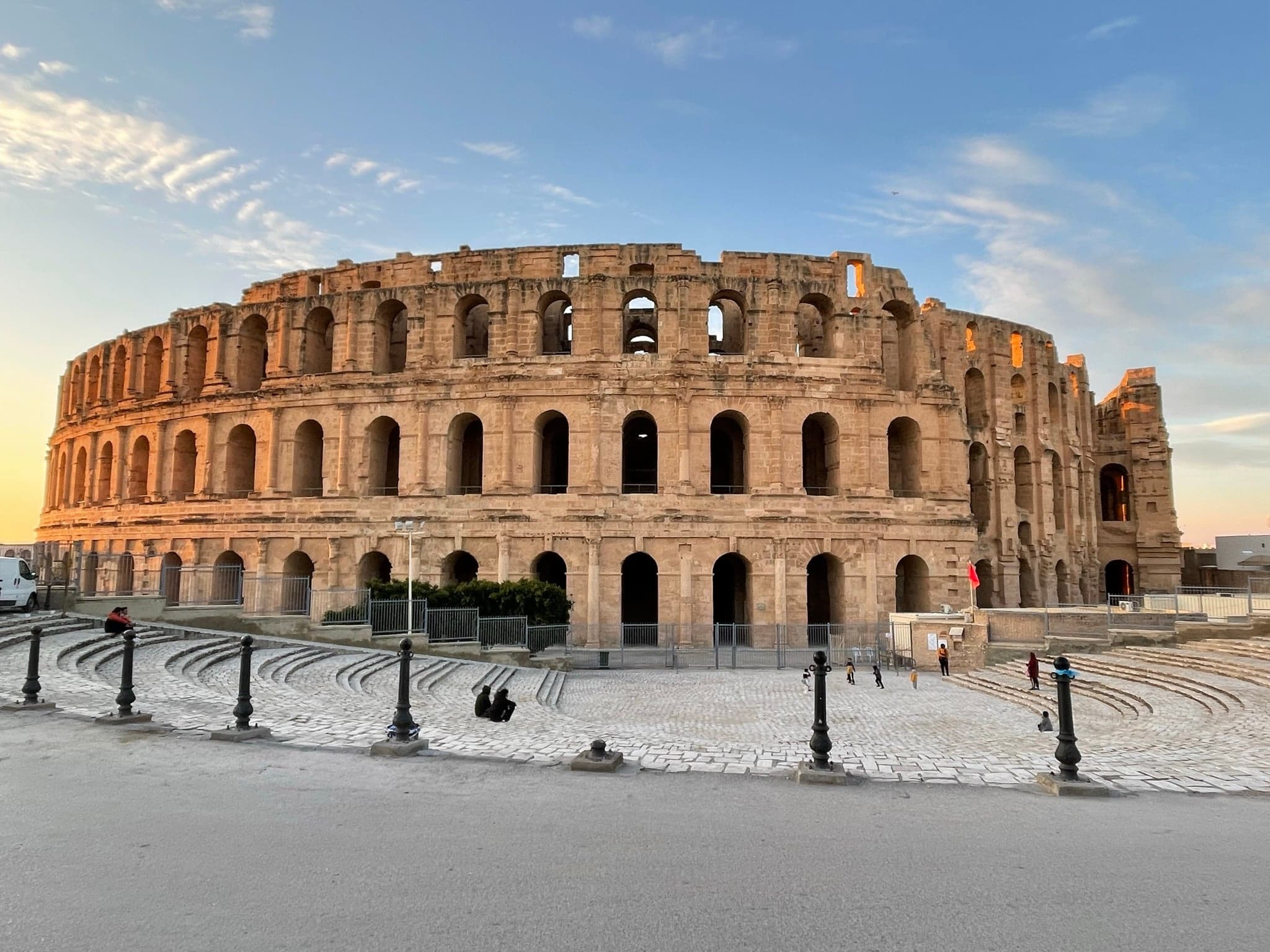 The enormous oval stone walls of El Djem amphitheatre rising above the surrounding town
