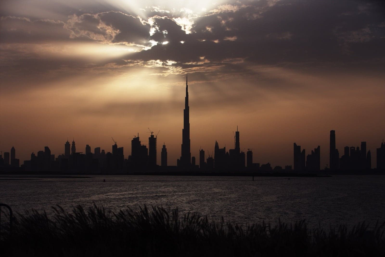 The Burj Khalifa rising above the Dubai skyline at sunset