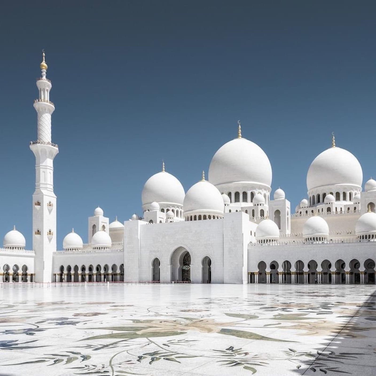 The white domes and arches of Sheikh Zayed Grand Mosque in Abu Dhabi