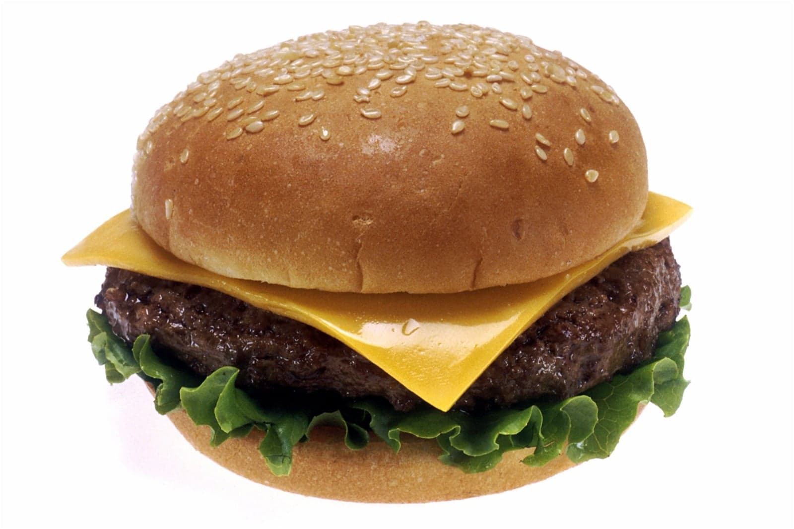 A classic cheeseburger with lettuce and melted cheese in a sesame bun