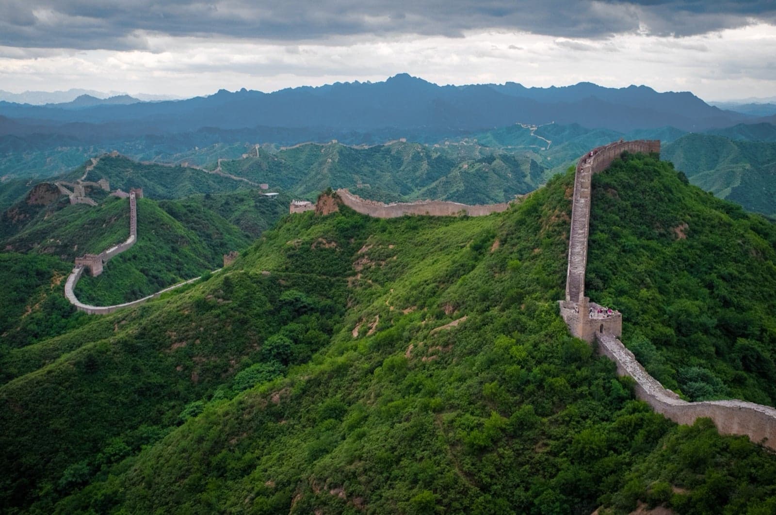 The Great Wall winding over green mountains at Jinshanling