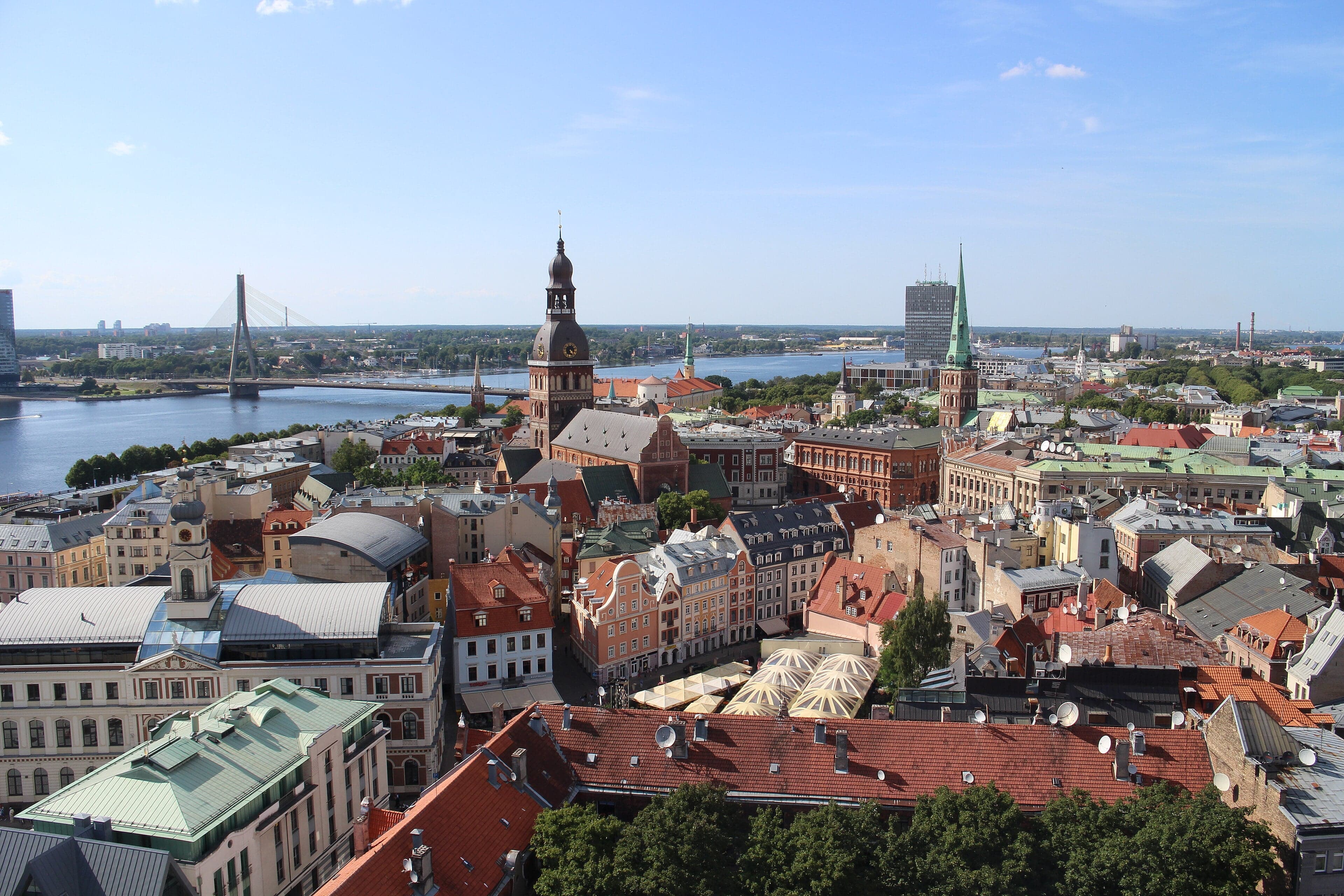 Colourful medieval buildings along a cobblestone street in Riga Old Town