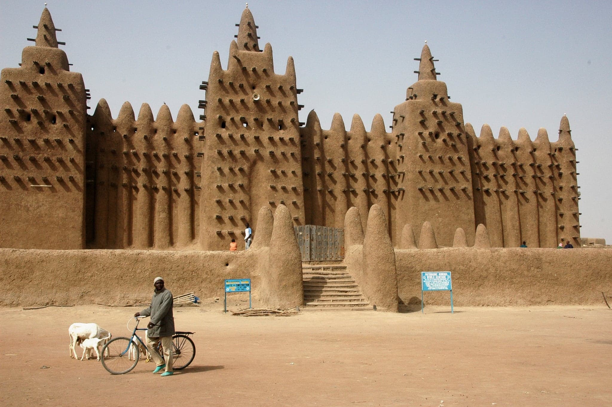 The Great Mosque of Djenné with its tall towers rising above the busy market square