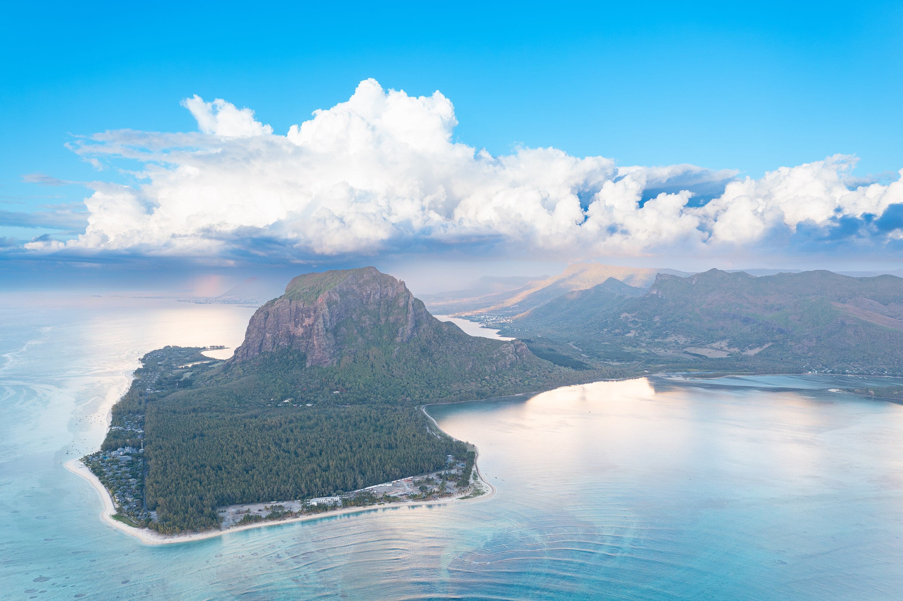 The flat-topped Le Morne Brabant mountain rising steeply from a turquoise lagoon