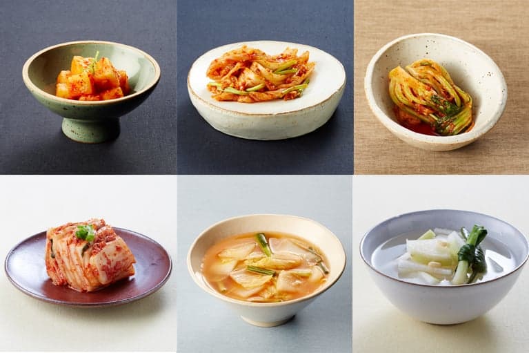 A bowl of bright red kimchi made from fermented cabbage