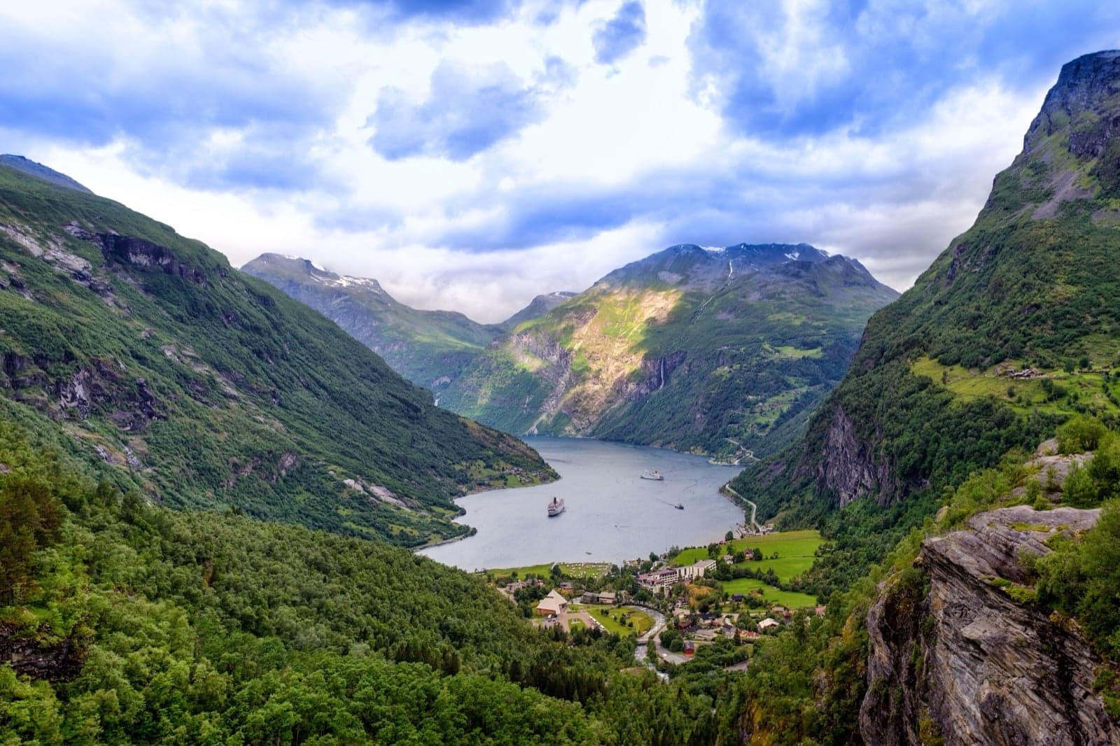 Geirangerfjord, with steep cliffs plunging down into deep blue water