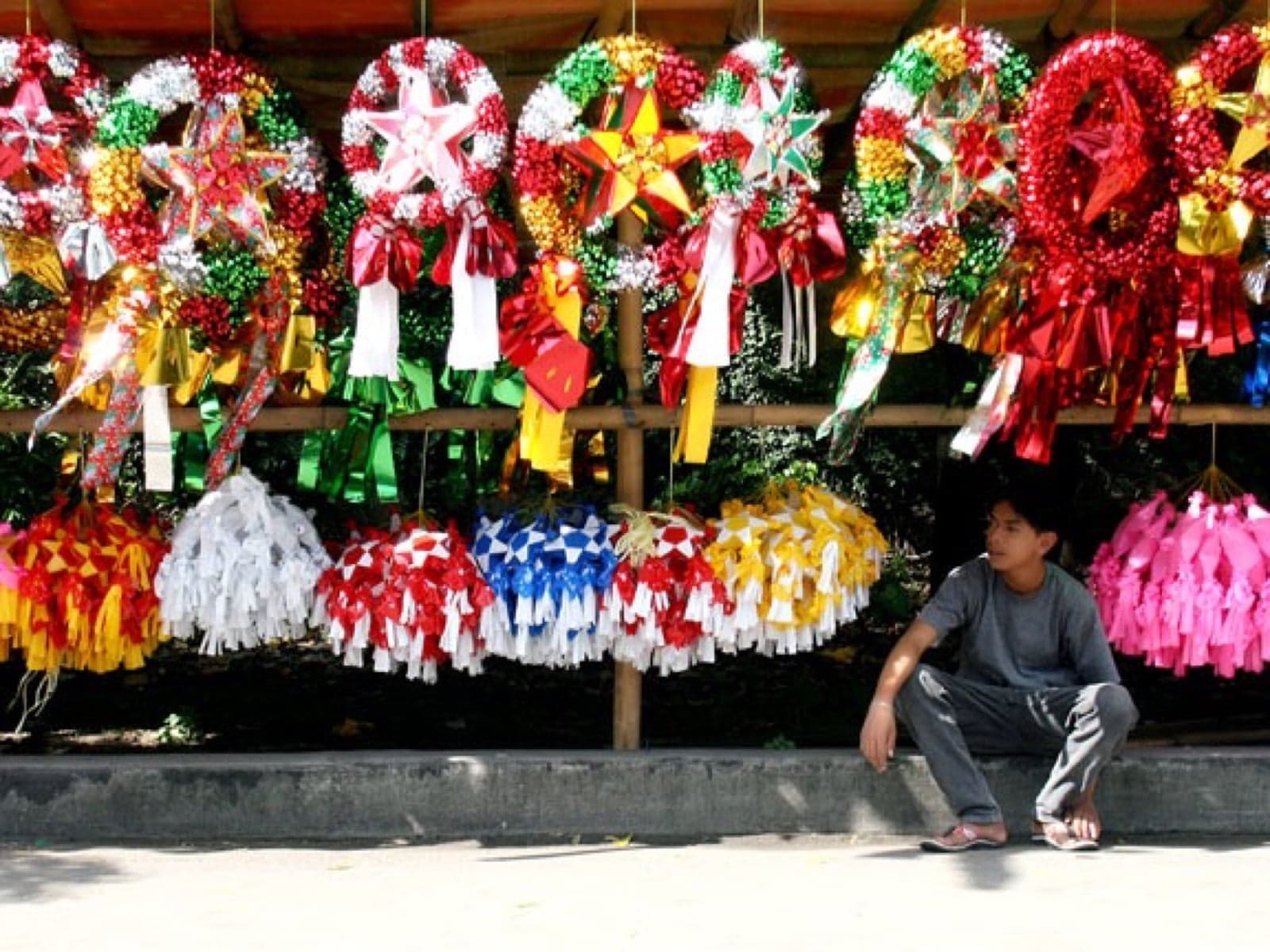 Colourful star-shaped parol Christmas lanterns hanging in a Philippine market