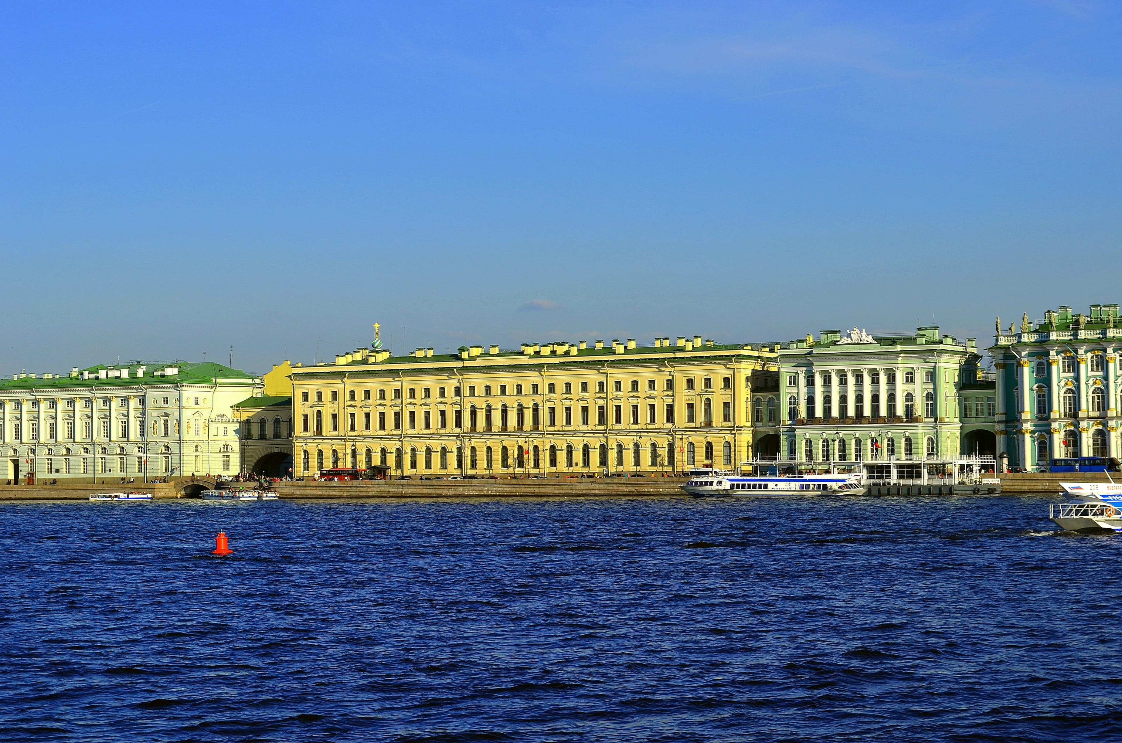 The grand green-and-white Winter Palace building that houses the Hermitage Museum in Saint Petersburg