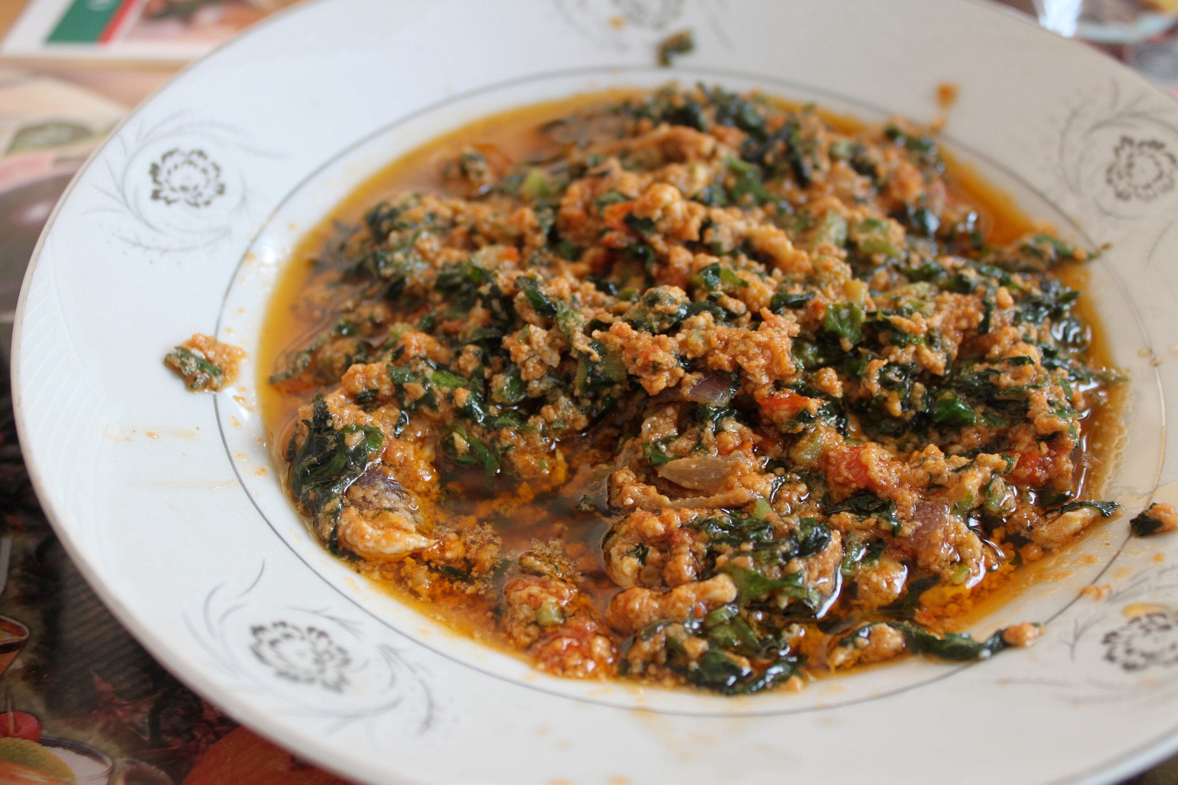 A colourful spread of different Sierra Leonean leaf stews with rice