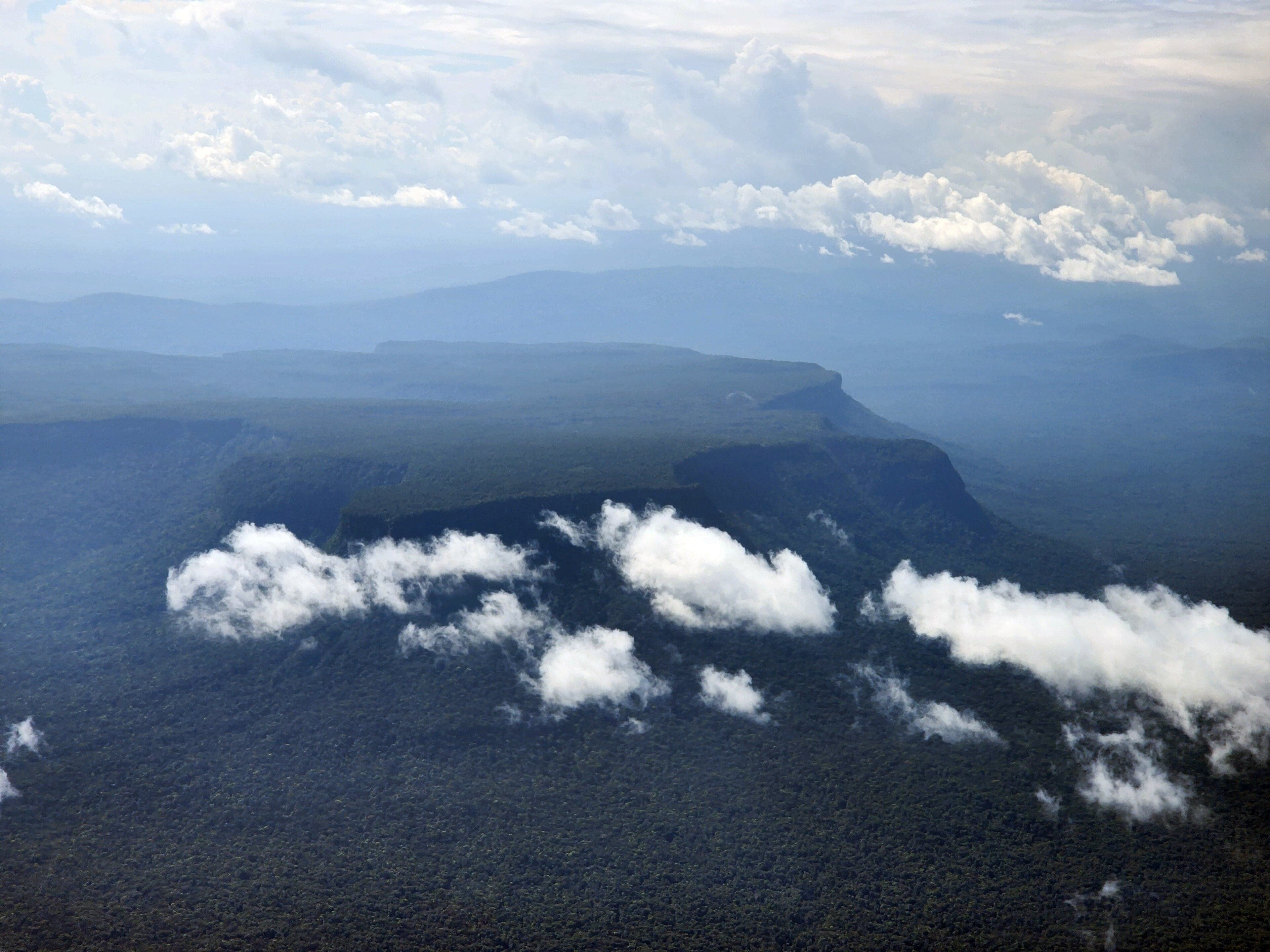 The flat-topped Tafelberg plateau rising above the Suriname rainforest